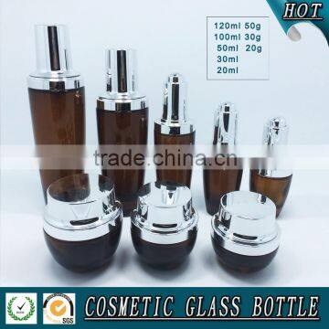 Amber coloured cosmetic glass lotion bottles with silver pump cap