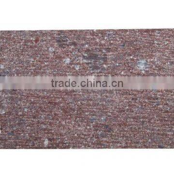 Chiselled red porphyry paving stone