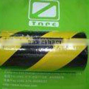 Black and yellow barrier tape