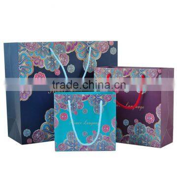 Luxury CMYK 250gsm C2S art paper material dress packaging paper bag