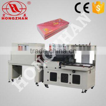 High speed auto L-bar sealer and shrink tunnel