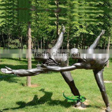 Bronze roller skating couple statue