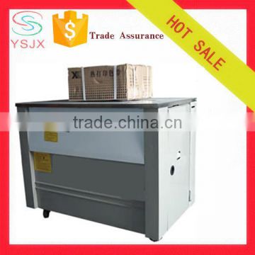 Semi-automatic packaging machine for cardboard boxes