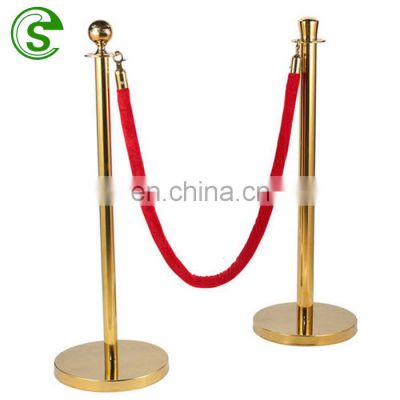 Lobby brass stanchions post and red velvet rope