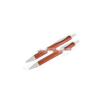 red wooden ball pen