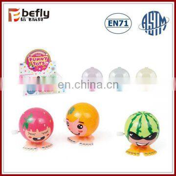 Cheap plastic jumping fruit wind up toy on alibaba