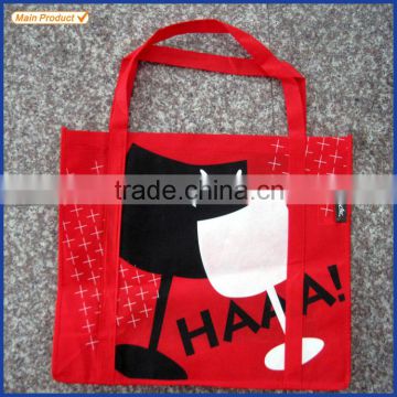 Red non woven polypropylene tote bag with long strong handles