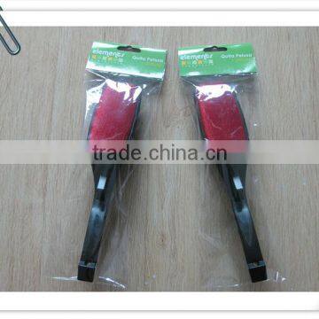 Black plastic handle suit brush