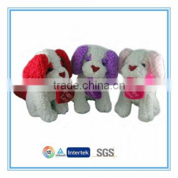 Plush dog toy with red heart