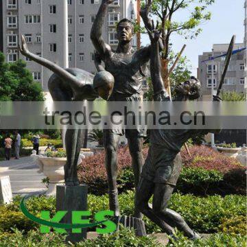 Bronze playing basketball player sculpture