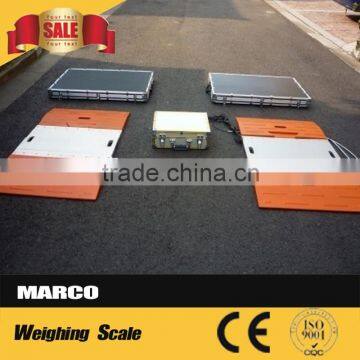 Portable load weighing pad in-motion axle scale