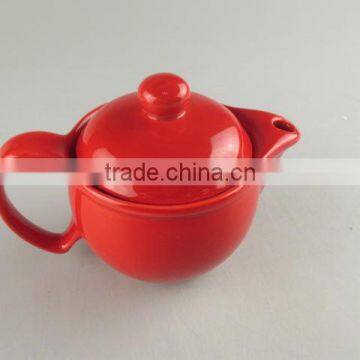 Glazed red round porcelain teapot in stock