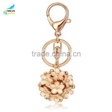 Latest fashion alloy hollow out drip flower key chain samples