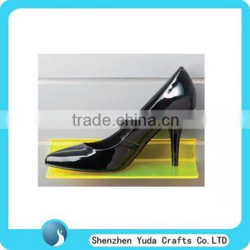 Fluorescent yellow slatwall acrylic high heels display, lucite flat shoes display rack