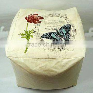 100%C pouf with flower print and butterfly embroidery