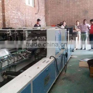 Fully automatic corrugated paperboard carton box folding and gluing machine