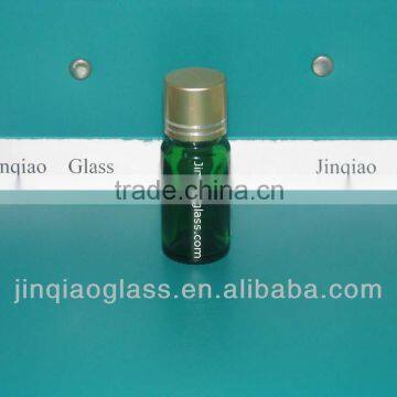 small green glass bottle for essential oil