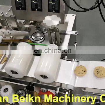 Automatic encrusting and forming machine for chocolate chip cookie