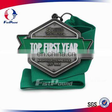 Top First Year Antique Finish Medal with Green Grosgrain Ribbon