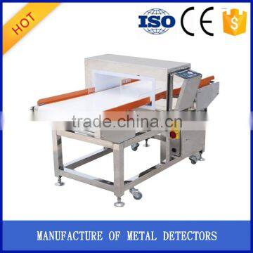 Food metal detector with conveyor