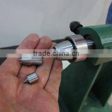 Tip changeable by Knock-out bar on tailstock
