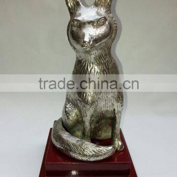 animal sculpture with wood base