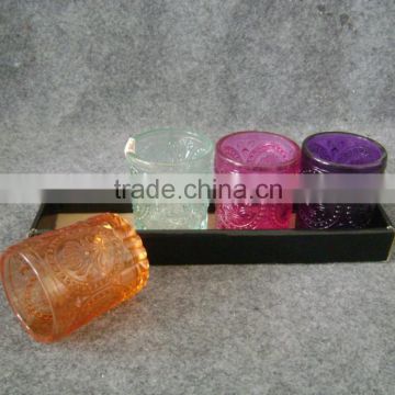 Colorful glass candle holder with embossed pattern