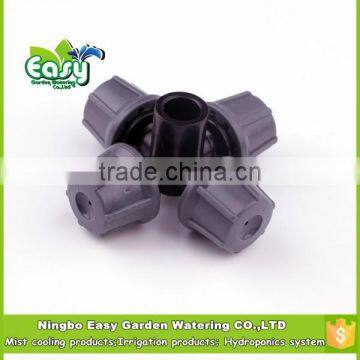 Four way mister. Micro sprinkler in grey color.micro Mister. Micro Irrigation sprinkler. Micro irrigation mister