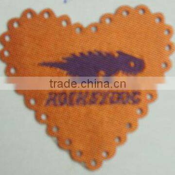 Heart shaped laser cut woven label