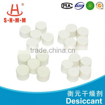 Moisture absorbing desiccant with small bottle for cargo