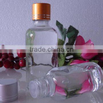 Small wine glass bottle with golden lid odd-shaped glass wine bottle