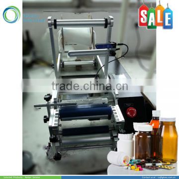 Semi-automatic manual labeling machine for round container