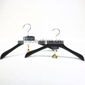 Plastic shirt hanger with metal hook