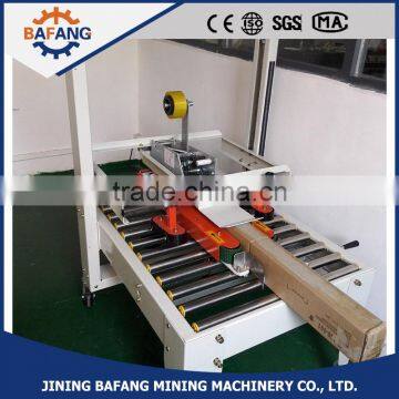 Semi-auto boxes sealing strapping machine