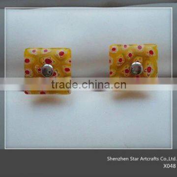 X048 Yellow cufflinks with red dots