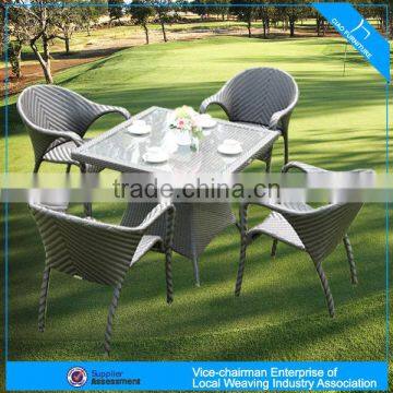 A - modern square glass dining table and wicker stackable chair setting 1883+8058