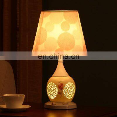 Chinese style bedroom bedside creative hollow simple and warm ceramic table lamp