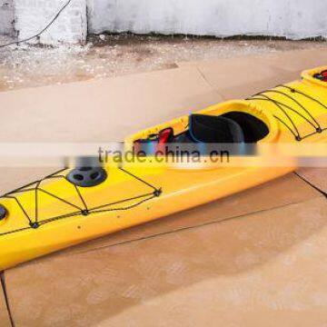 two person sit in ocean kayak