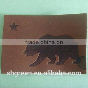 Embossed bear logo leather label for suits