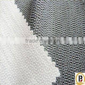 Tricot knitted woven fusible interlining/interfacing fabric