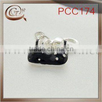 black with white point bra shaped pendant