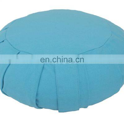 Pleated  Zafu cushion for sitting on Meditation postures made out of dyed cotton canvas fabric filled with Buckwheat hull