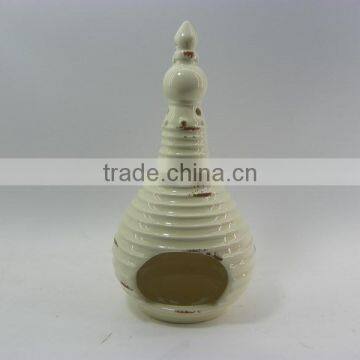 cream-colored ceramic tealight holder