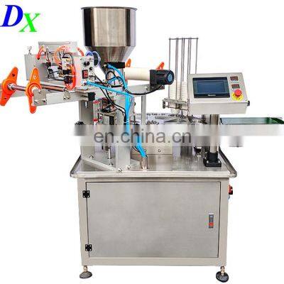 Automatic Mul-tifunction Oil Milk Yogurt Jam Jelly Servo Rotary k Cup Filling Sealing Machine