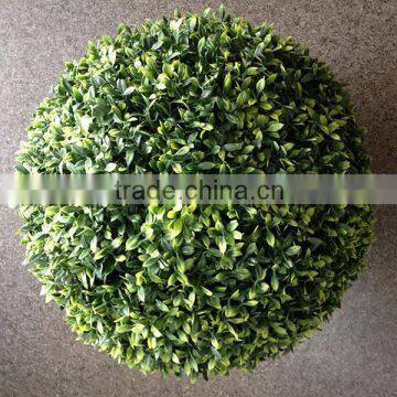 Green color artificial grass ball with tea leaf shape