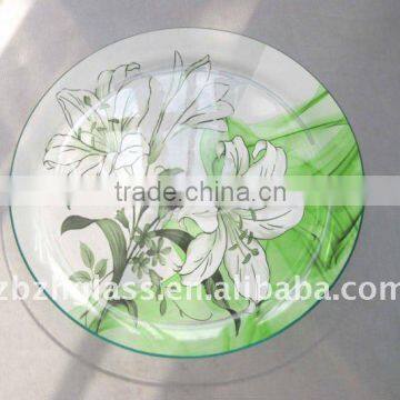 round glass plate with flower design