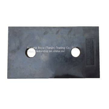 Elastomeric neoprene bridge bearing pads with holes