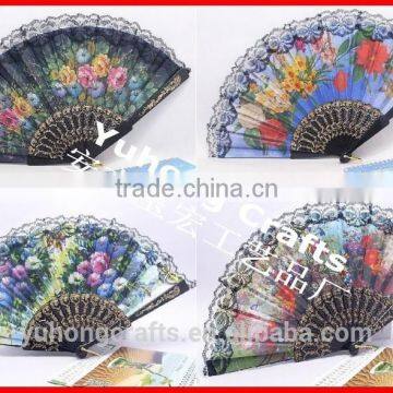 Spanish style plastic folding fan with flower
