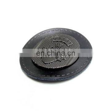 Round shape black real leather embossed Gun metal plate on leather denim labels .