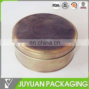 Vintage flat round tin box with embossed logo to metal storage box